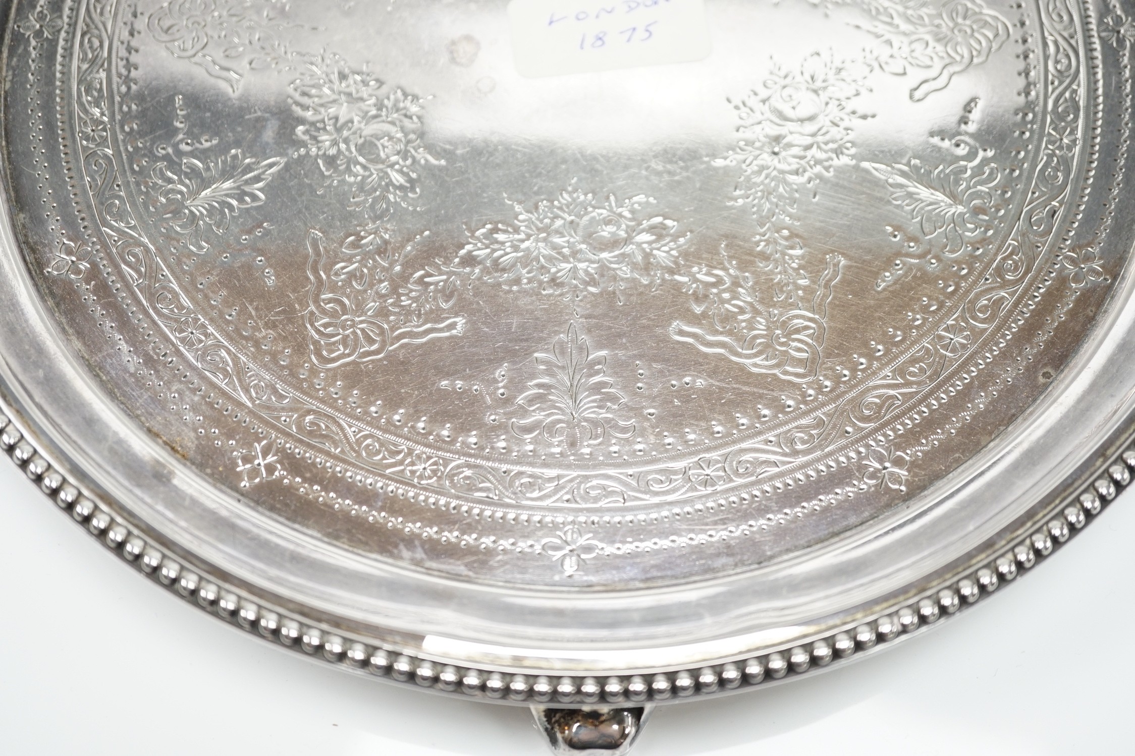 A Victorian engraved silver circular salver, Edward Charles Brown, London, 1875, 25.7cm, 18.8oz.